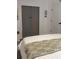 Comfortable bedroom featuring a custom closet, soft lighting, and cozy decor at 4510 El Conquistador Pkwy # 105, Bradenton, FL 34210
