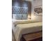 Spacious bedroom with stylish decor and a decorative tufted headboard at 4510 El Conquistador Pkwy # 105, Bradenton, FL 34210