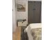 Comfortable bedroom with red truck painting, closet and stylish decor at 4510 El Conquistador Pkwy # 105, Bradenton, FL 34210