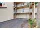 Condo exterior featuring garage, multiple balconies, and well-maintained landscaping at 4510 El Conquistador Pkwy # 105, Bradenton, FL 34210