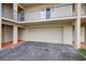 Spacious attached garage beneath condo building provides convenient parking and storage, as well as quick access to unit at 4510 El Conquistador Pkwy # 105, Bradenton, FL 34210