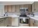 Well-equipped kitchen with stainless steel appliances, modern cabinets, and a functional layout at 4510 El Conquistador Pkwy # 105, Bradenton, FL 34210