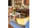 Open-concept living room and dining area featuring contemporary furniture and decor at 4510 El Conquistador Pkwy # 105, Bradenton, FL 34210
