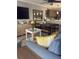 Open-concept living room with modern kitchen, stylish decor, and comfortable seating at 4510 El Conquistador Pkwy # 105, Bradenton, FL 34210