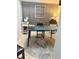 Well-lit home office featuring wood accent wall, large round rug and desk space for efficient work at 4510 El Conquistador Pkwy # 105, Bradenton, FL 34210