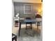 Well-lit home office featuring wood accent wall, large round rug and desk space for efficient work at 4510 El Conquistador Pkwy # 105, Bradenton, FL 34210