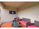 Inviting outdoor patio with comfortable seating, dartboard, and ambient string lights at 4510 El Conquistador Pkwy # 105, Bradenton, FL 34210