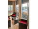 Relaxing sunroom with outdoor furniture overlooking the community at 4510 El Conquistador Pkwy # 105, Bradenton, FL 34210