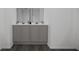 Modern bathroom with double vanity, gray cabinets, and a large mirror at 4610 Hawthorn Avenue, Parrish, FL 34219