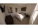 Cozy bedroom featuring a large bed with neutral bedding, soft carpet and dimmable bedside lamps at 4610 Hawthorn Avenue, Parrish, FL 34219