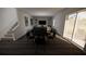 Open concept living and dining area with stairs leading to the second floor and a large window at 4610 Hawthorn Avenue, Parrish, FL 34219