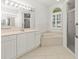 Bright bathroom featuring a bathtub, shower, and sink at 4613 Sweetmeadow Cir, Sarasota, FL 34238