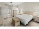 This bedroom is bright and airy and features neutral tones and an attached hallway at 4613 Sweetmeadow Cir, Sarasota, FL 34238