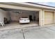 Spacious two car garage featuring overhead lighting, ample storage space and epoxy flooring at 4613 Sweetmeadow Cir, Sarasota, FL 34238