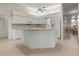 Open-concept kitchen with a center island, modern appliances and plenty of cabinet space at 4613 Sweetmeadow Cir, Sarasota, FL 34238
