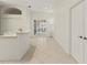 Open floor plan with kitchen bar and doors leading to the pool at 4613 Sweetmeadow Cir, Sarasota, FL 34238