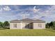 Stunning rear view of the house with a well-manicured lawn and a private backyard at 4614 Hawthorn Avenue, Parrish, FL 34219