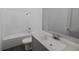 Bright bathroom featuring a shower-tub combo, neutral-toned vanity with solid surface, and white tile at 4614 Hawthorn Avenue, Parrish, FL 34219