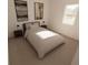 Cozy bedroom with a full-sized bed, accent lamps, neutral decor, and plush carpet at 4614 Hawthorn Avenue, Parrish, FL 34219