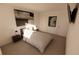 Cozy bedroom with neutral decor, a full-size bed, and stylish bedside tables at 4618 Hawthorn Ave, Parrish, FL 34219
