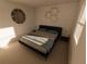 Well-lit bedroom featuring a full-size bed and elegant decor at 4618 Hawthorn Ave, Parrish, FL 34219