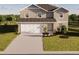 Charming two-story home featuring a spacious driveway and well-manicured front lawn at 4618 Hawthorn Ave, Parrish, FL 34219
