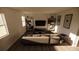 Stylish living room featuring hardwood floors and a modern entertainment center at 4618 Hawthorn Ave, Parrish, FL 34219