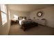 Serene bedroom with a queen bed, accent lighting, and decorative mirror at 4618 Hawthorn Ave, Parrish, FL 34219