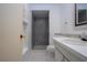 Bathroom featuring a walk-in shower, tiled floors, and single sink vanity at 466 Sunnyside Dr, Venice, FL 34293