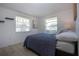 Bedroom features light wood floors, a window, and accent shelving at 466 Sunnyside Dr, Venice, FL 34293