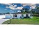Charming single-story home with a well-manicured lawn, updated roof, and lovely landscaping at 466 Sunnyside Dr, Venice, FL 34293
