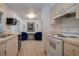 A well-lit kitchen leads to an area with blue chairs and a heron picture at 466 Sunnyside Dr, Venice, FL 34293