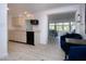 Bright kitchen with white cabinetry, modern appliances, and open layout at 466 Sunnyside Dr, Venice, FL 34293
