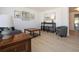 Bright living room featuring neutral walls, updated flooring, and tasteful decor at 466 Sunnyside Dr, Venice, FL 34293