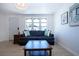 Living room view featuring hardwood floors, natural light, and stylish furnishings at 466 Sunnyside Dr, Venice, FL 34293