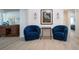 Cozy sitting area showcasing stylish blue chairs and elegant decor at 466 Sunnyside Dr, Venice, FL 34293