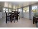 Inviting sunroom featuring a dining table and views of the outdoors at 466 Sunnyside Dr, Venice, FL 34293