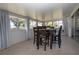 Inviting sunroom featuring a dining table and views of the outdoors at 466 Sunnyside Dr, Venice, FL 34293