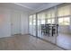 Bright sunroom featuring tiled floors and a dining set near sliding glass doors at 466 Sunnyside Dr, Venice, FL 34293