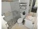 Renovated bathroom featuring a glass shower and tiled floors at 4754 Sabal Key Dr, Bradenton, FL 34203