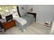 Cozy bedroom with gray walls, light wood floors, and ample natural light at 4754 Sabal Key Dr, Bradenton, FL 34203