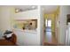 Bright dining area with a view into the kitchen, laminate flooring, and neutral paint at 4754 Sabal Key Dr, Bradenton, FL 34203