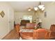 Cozy dining area with a wooden table and chairs, laminate flooring, and a chandelier at 4754 Sabal Key Dr, Bradenton, FL 34203
