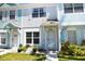 Charming multi-colored townhome featuring a well-manicured lawn and bright curb appeal at 4754 Sabal Key Dr, Bradenton, FL 34203