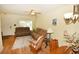 Comfortable living room with neutral tones, laminate flooring, and lots of natural light at 4754 Sabal Key Dr, Bradenton, FL 34203