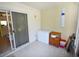 Enclosed patio with tiled floors and sliding glass door to the kitchen at 4754 Sabal Key Dr, Bradenton, FL 34203