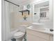 Bright bathroom with modern sink, blue tile, and coastal decorations at 5014 Marshfield Rd # 30, Sarasota, FL 34235