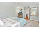 Stylish bedroom featuring wood floors, and eclectic dresser, and walkout access to a patio at 5014 Marshfield Rd # 30, Sarasota, FL 34235