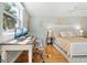 Light and airy bedroom featuring a home office with bright light and decorative elements at 5014 Marshfield Rd # 30, Sarasota, FL 34235