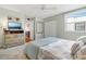 Comfortable bedroom with a soft color scheme and a dresser offering ample storage space and style at 5014 Marshfield Rd # 30, Sarasota, FL 34235